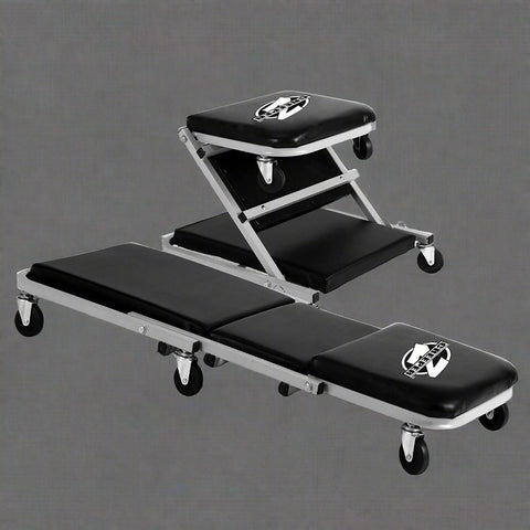 Mechanics creeper rolling cart with padded vinyl surface

Convertible garage seat and creeper with 6 caster wheels

Black auto repair creeper with metal frame and seat

S1066 rolling creeper seat in upright position for repairs