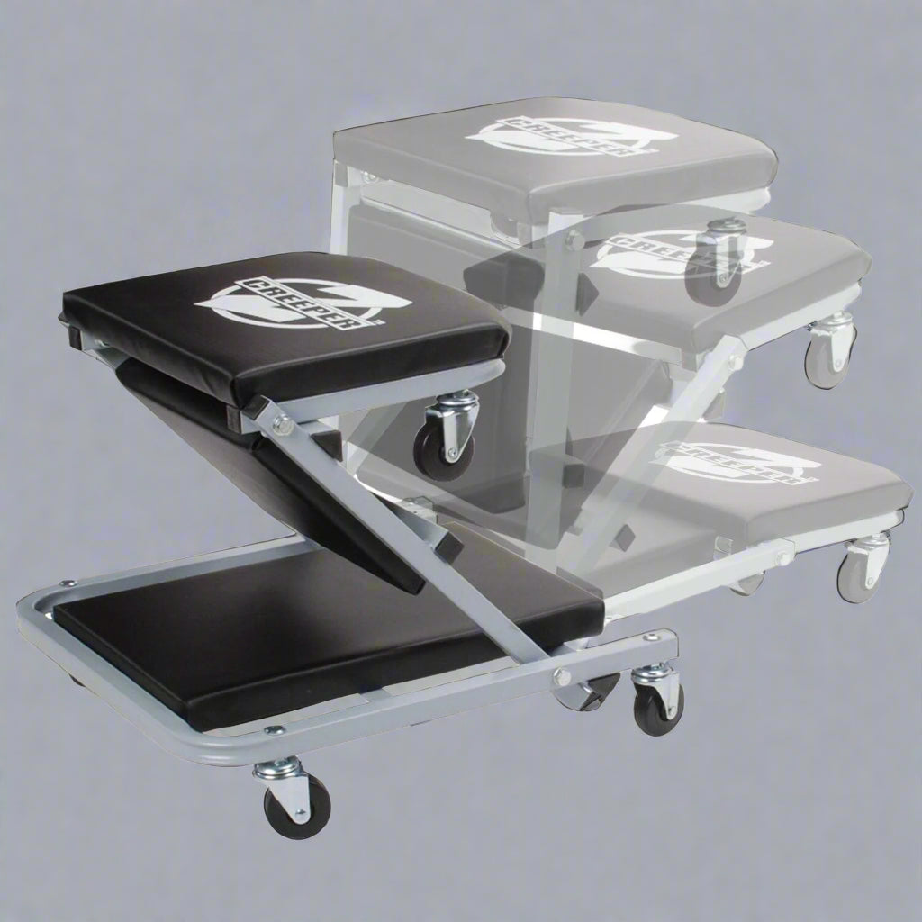 Mechanics creeper rolling cart with padded vinyl surface

Convertible garage seat and creeper with 6 caster wheels

Black auto repair creeper with metal frame and seat

S1066 rolling creeper seat in upright position for repairs