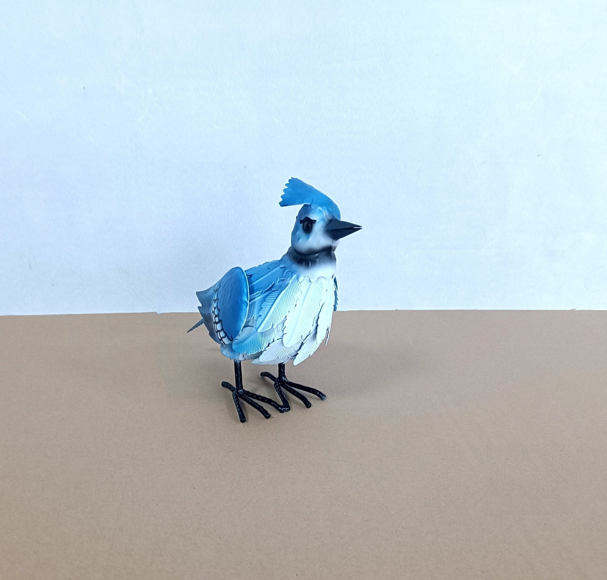 Blue Jay Figurine: Blue Metal Blue Jay Bird Sculpture – Outdoor Garden Art

Both Birds: Set of Metal Bird Yard Art Statues – Red Cardinal & Blue Jay

Close-ups: Close-Up View of Hand-Painted Outdoor Bird Figurines