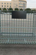 Foldable galvanized metal storage cage on warehouse floor

Stackable wire cage for industrial storage

Metal pallet container with wire mesh

Folded storage cage for compact transport

Warehouse bins stacked for storage optimization