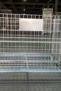 Foldable galvanized metal storage cage on warehouse floor

Stackable wire cage for industrial storage

Metal pallet container with wire mesh

Folded storage cage for compact transport

Warehouse bins stacked for storage optimization