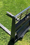 Mini skid steer pallet fork attachment with 2205 lb lift capacity
Heavy-duty pallet forks for Dingo-style mini loaders
Black steel frame and tines for mini skid steer forklift attachment
Compact pallet fork attachment mounted on mini track loader