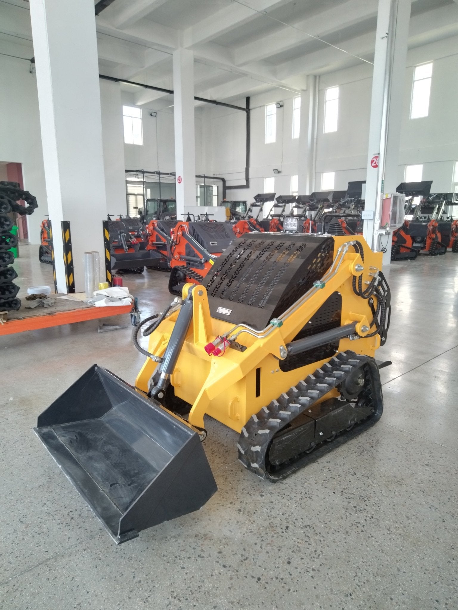 “T380 compact skid steer loader with rubber tracks”

“T460 mini tracked loader for landscaping and excavation”

“Heavy-duty skid steer with universal quick attach plate”

“Tracked compact construction loader in yellow”