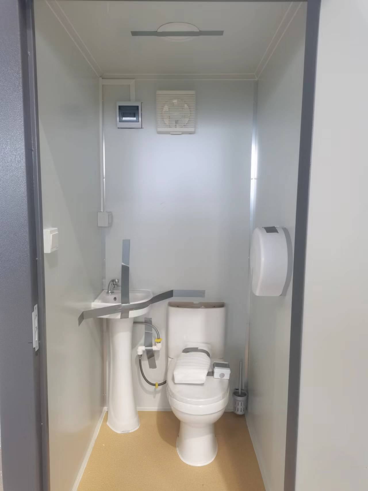 Gray single toilet portable restroom trailer
Double stall mobile toilet unit for construction use
Interior view of portable washroom with sink
Mobile shower unit with privacy enclosure
Pre-installed fixtures inside portable toilet and shower model