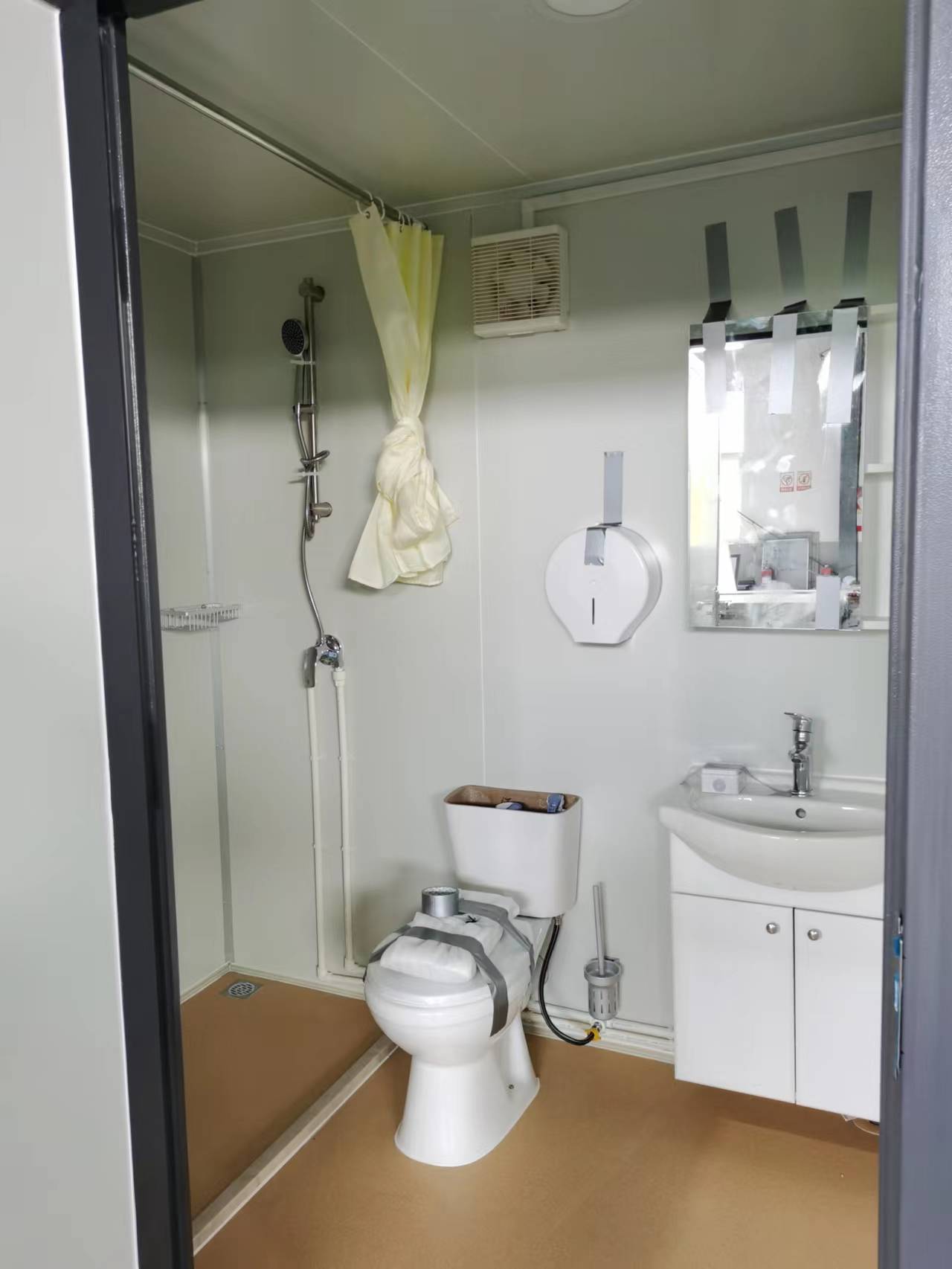 Gray single toilet portable restroom trailer
Double stall mobile toilet unit for construction use
Interior view of portable washroom with sink
Mobile shower unit with privacy enclosure
Pre-installed fixtures inside portable toilet and shower model