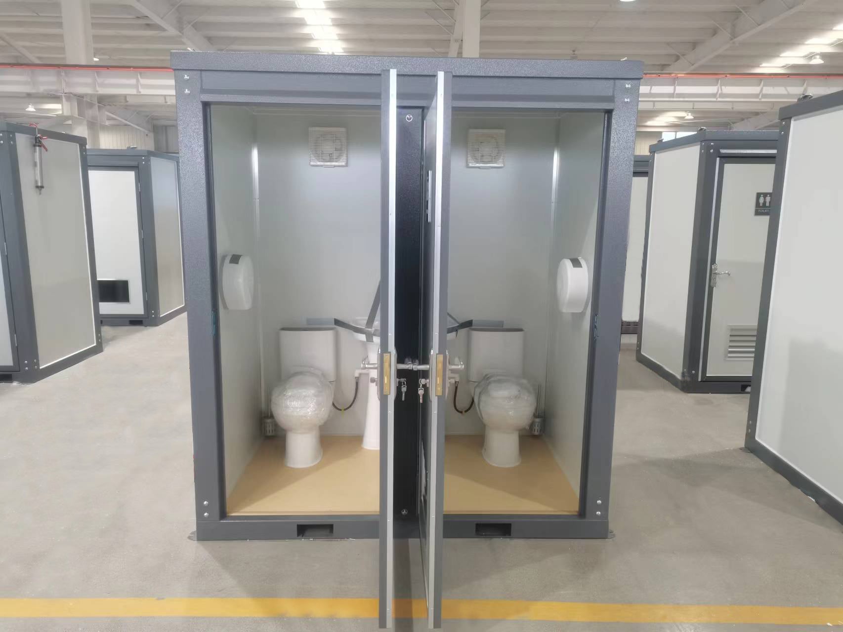 Gray single toilet portable restroom trailer
Double stall mobile toilet unit for construction use
Interior view of portable washroom with sink
Mobile shower unit with privacy enclosure
Pre-installed fixtures inside portable toilet and shower model