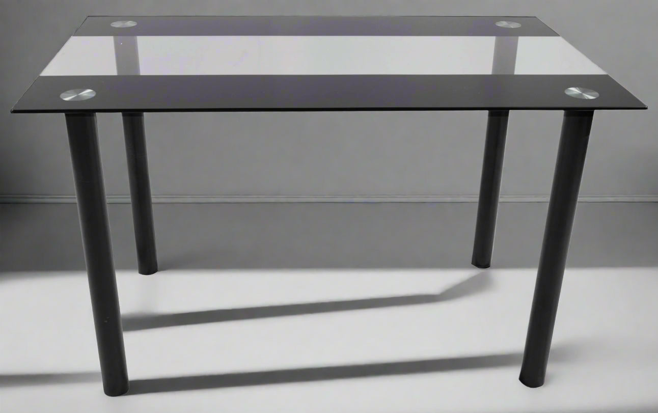 Close-up of black tempered glass tabletop with chrome legs