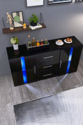 Black high gloss LED TV cabinet in living room setup
White buffet sideboard with drawers and LED lights
Modern entertainment unit with glass shelving and TV
LED color lighting demo of high gloss sideboard
Back view of storage cabinet setup
Removable center shelf in TV cabinet
Interior drawer and shelving details