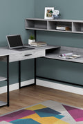 "Modern L-shaped home office desk with wood grain finish"

"Corner workstation desk with metal frame and storage shelves"

"White modern L-shaped computer desk for home office"

"Spacious workstation setup with storage shelving"

"Home office desk with wood grain surface and black frame"