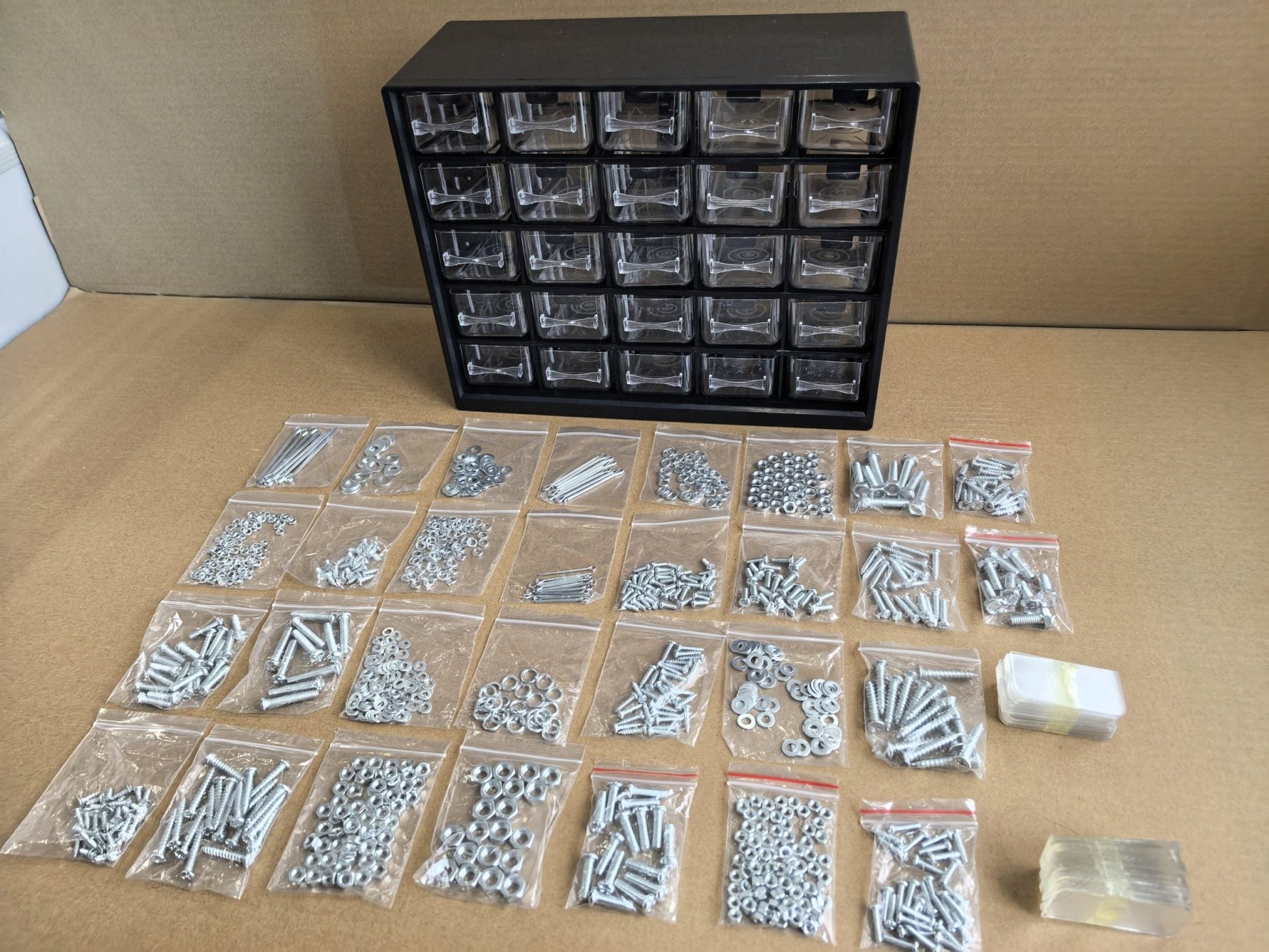 Multipurpose fastener kit with labeled drawers

1001-piece screw and bolt organizer cabinet

Open storage cabinet with hardware compartments

Assorted fasteners and storage trays

Compact metal fastener case for shop and garage use