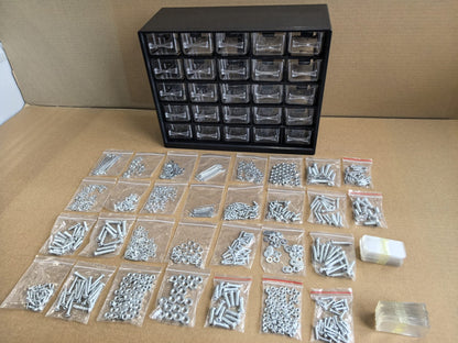 Multipurpose fastener kit with labeled drawers

1001-piece screw and bolt organizer cabinet

Open storage cabinet with hardware compartments

Assorted fasteners and storage trays

Compact metal fastener case for shop and garage use
