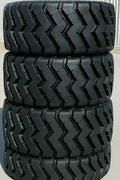 Heavy-duty E-3/L3 bias ply loader tire on warehouse floor

Rock lug pattern close-up for traction

20.5-25 loader tire tread and sidewall view

Mining OTR tire mounted on equipment

Rugged loader tire for industrial applications
