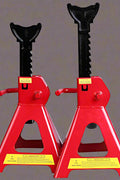 “Pair of red heavy-duty jack stands on concrete garage floor”

“6-ton jack stands with ratchet and locking pin”

“12-ton jack stands supporting heavy-duty pickup truck”