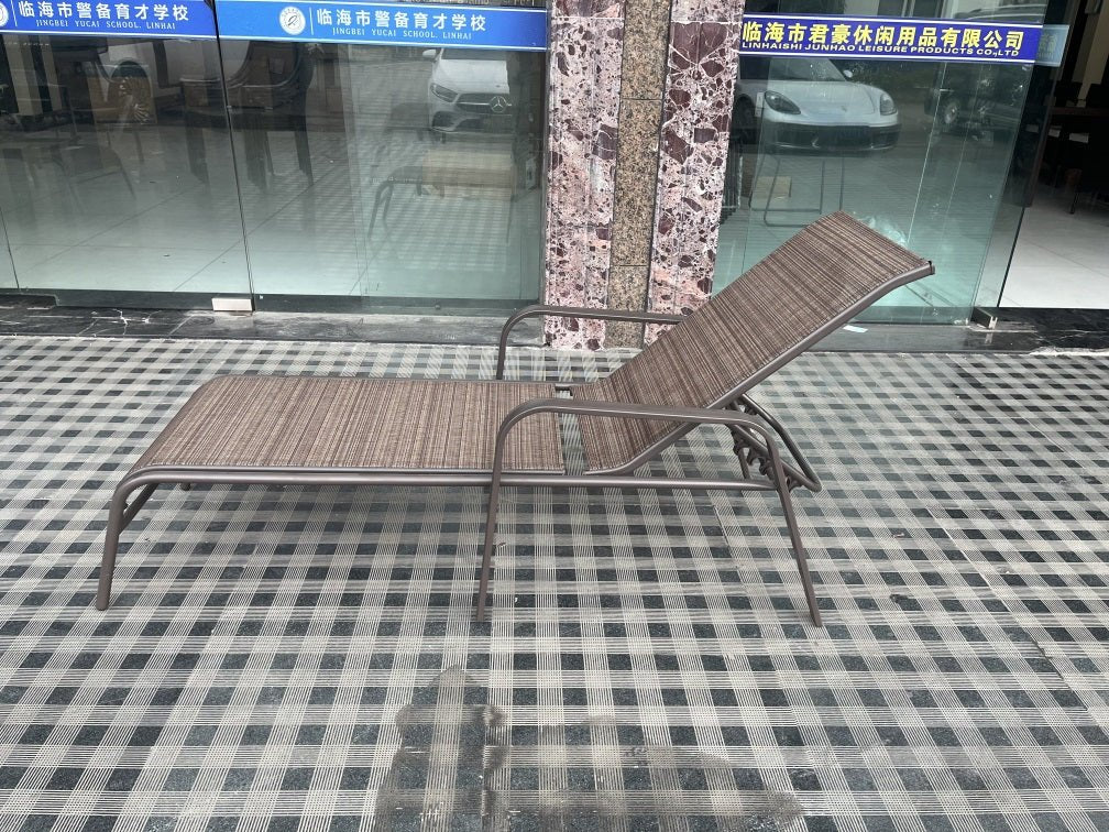 Reclining folding patio lounger chair on the beach

Adjustable sun lounger with breathable Teslin mesh

Close-up of outdoor lounger armrest and frame

Folded outdoor lounge chair ready for storage

Lounger chair beside swimming pool deck