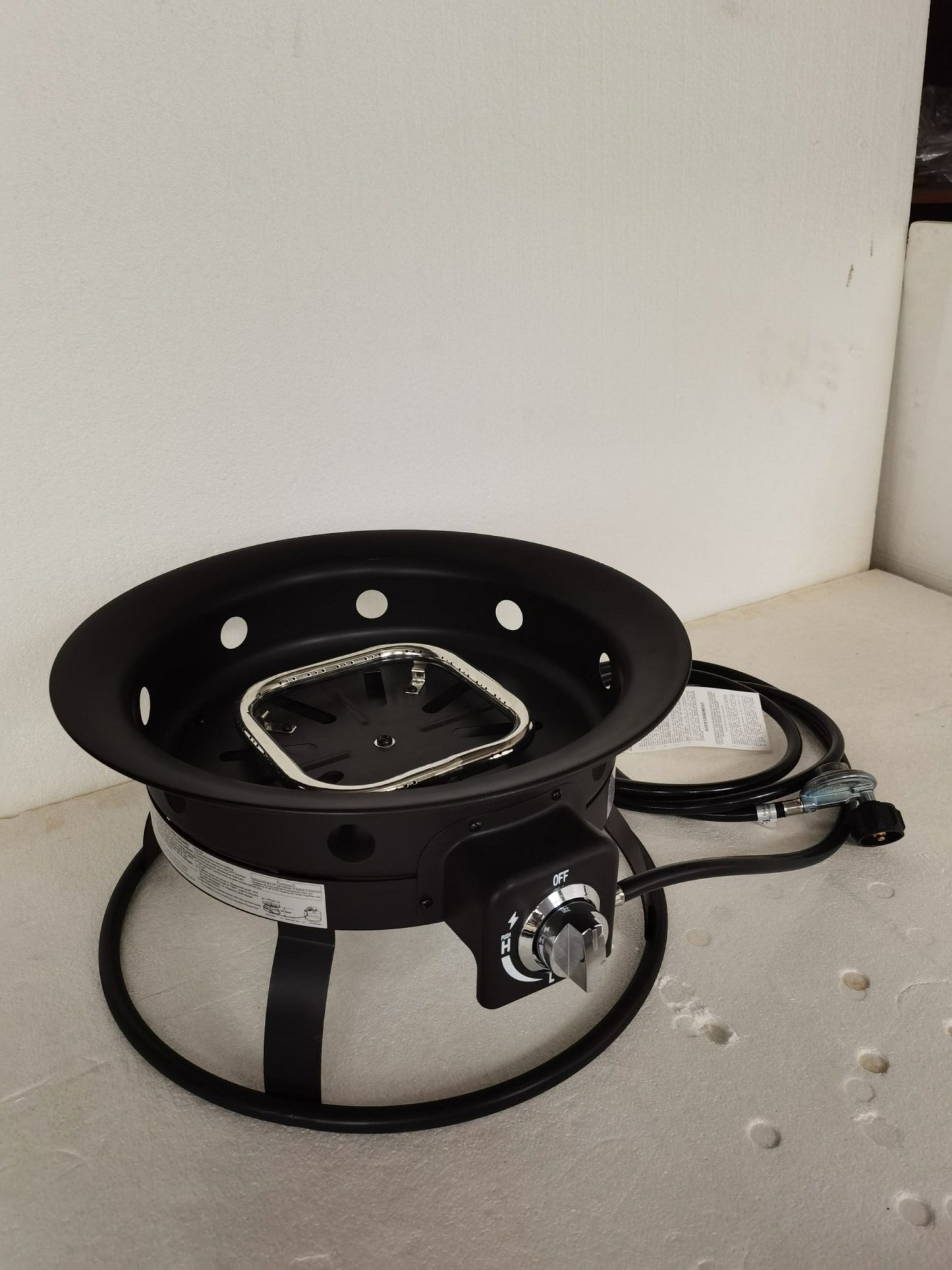52,000 BTU propane fire pit with lava rocks burning

portable camping fire pit with BBQ grill top

outdoor propane fire pit kit with hose and stand

black fire pit for patio and tailgate cooking

propane gas fire pit with included lava rocks