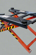 “Portable 6,000 lb automotive scissor lift with orange hydraulic frame”

“Hydraulic car hoist platform for lifting vehicles in garages”

“Mobile scissor lift for auto repair and maintenance tasks”