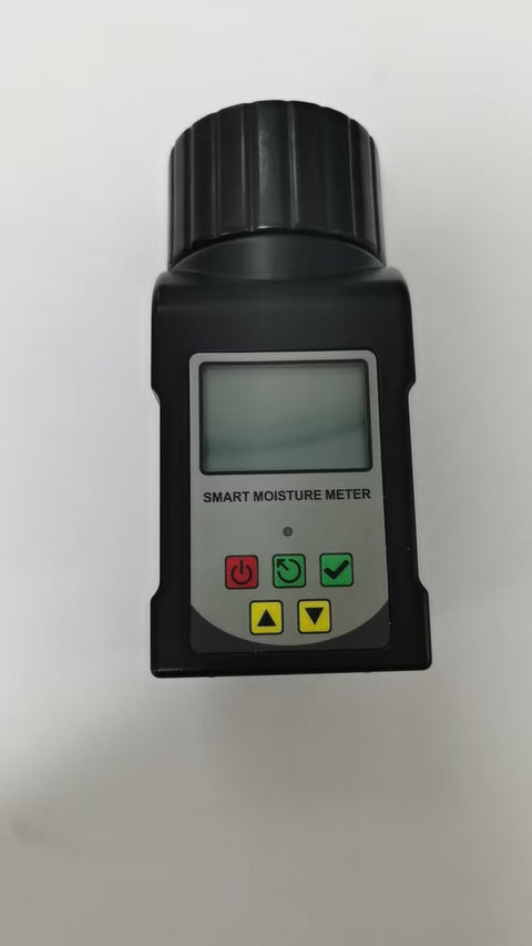 Digital grain moisture tester showing LCD screen readings

MT2599 grain tester with large sample chamber

Portable moisture meter for field and warehouse use

Moisture tester measuring corn sample

Digital analyzer for wheat, rice, cocoa, and coffee beans