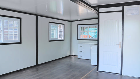 Exterior view of 2-bedroom deluxe folding house

Modern prefabricated orange modular home

Inside view of compact folding prefab unit

Kitchen area with electric setup in prefab home

Folding house with porch roof kit variant