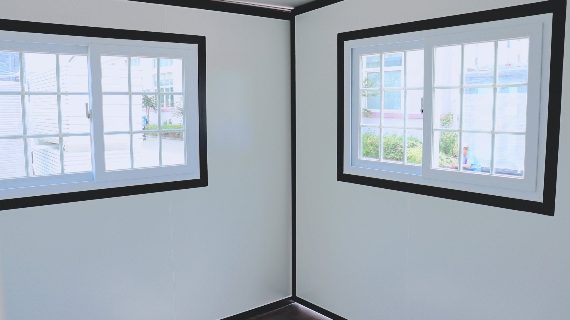 Exterior view of 2-bedroom deluxe folding house

Modern prefabricated orange modular home

Inside view of compact folding prefab unit

Kitchen area with electric setup in prefab home

Folding house with porch roof kit variant