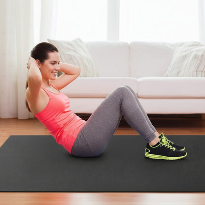 woman exercising on black non-slip fitness mat at home

large gorilla mat for home gym with yoga straps

extra thick workout mat for HIIT and cardio training

folded 7mm thick gym mat with carry handle

yoga and strength training on extra-large exercise mat