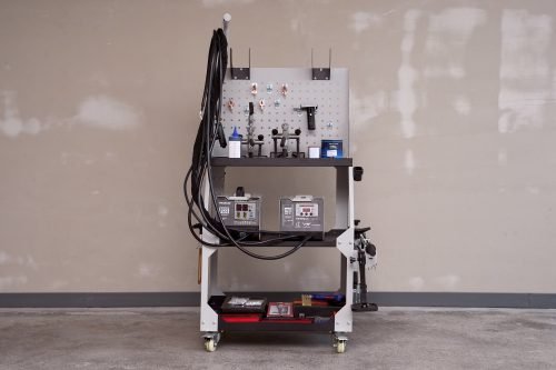 Main view of professional auto body dent welder machine

Welding gun and accessory layout in body shop

Open kit showing stud welder and tools

Slide hammer and puller accessories in case

Operational view of dent repair welder setup