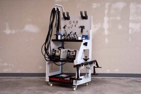 Main view of professional auto body dent welder machine

Welding gun and accessory layout in body shop

Open kit showing stud welder and tools

Slide hammer and puller accessories in case

Operational view of dent repair welder setup