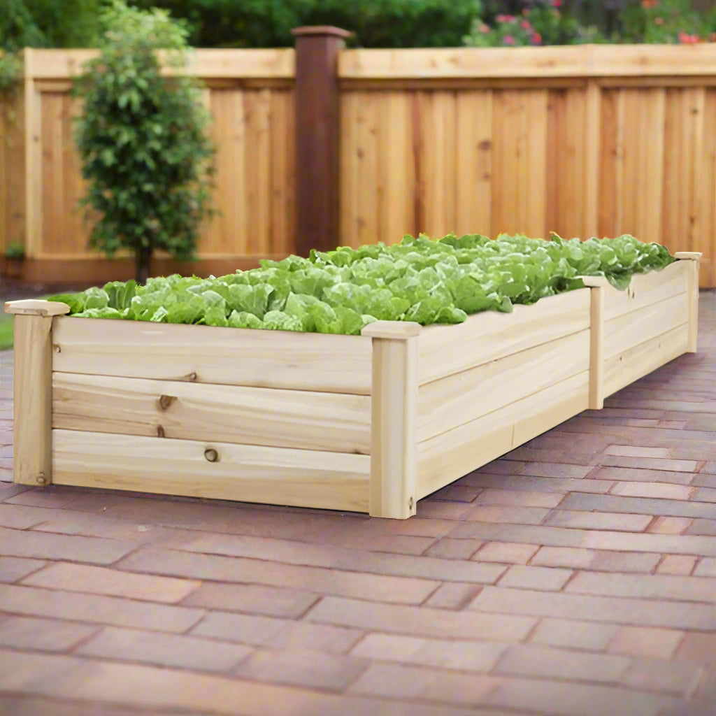 Raised wooden garden bed with central divider
Fir wood planter box assembled on backyard patio
Top view of divided raised bed filled with soil
Close-up of wooden planks and joinery for the garden box
Large rectangular raised garden bed for herbs and vegetables