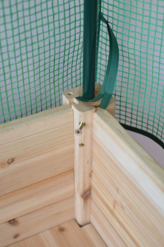 Wood raised garden bed with green greenhouse cover for backyard gardening

Elevated outdoor planter box with legs and protective greenhouse top

Side view of wooden garden planter for vegetables or herbs

Assembled raised garden box with protective cover and ventilation flap