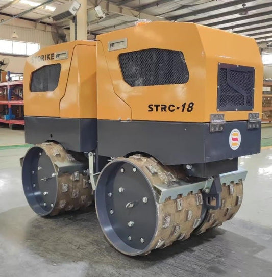 Front View of STORIKE 1114418 Remote-Controlled Trench Roller

Remote Control Device for Trench Roller Compactor

Side View of Heavy-Duty Soil Compactor Roller

STORIKE Trench Roller in Industrial Setting

Rear Angle of Remote-Controlled Soil Compactor