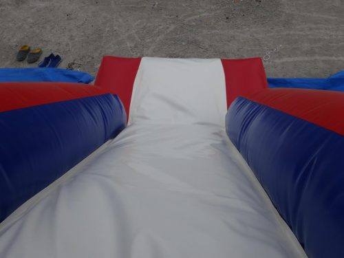 Red and blue bouncy castle with inflatable slide for commercial rental
18 ft long PVC inflatable bounce house and slide combo
Durable rental-grade inflatable with blower and safety features
Side view of heavy-duty bouncy castle in vibrant colors
Inflatable slide combo designed for kids' events and parties