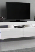 Modern RGB LED TV stand with lights under flat-screen TV
Black gloss entertainment unit with RGB lights in living room
White TV console with open shelving and LED lighting
Stylish high gloss media cabinet with mood lighting
Contemporary entertainment center for 75 inch TVs