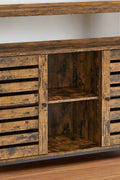 Rustic buffet cabinet with two louvered doors and adjustable shelves
Brown sideboard with open storage compartments and steel legs
Side view of rustic farmhouse cabinet in living room
Top surface of buffet cabinet styled with dishes and decor
Inside view of adjustable shelves and storage compartments