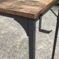 Rustic industrial computer desk with metal frame and storage hook – TLD003
Compact wood top desk with bag holder and steel legs – Model TLD003