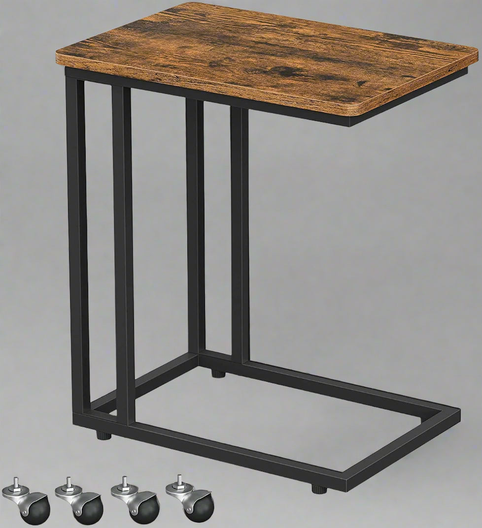 Rustic side table with laptop on top near sofa
Rolling wood TV tray with black metal legs
End table with wheels next to couch
Industrial-style side table for laptop and coffee