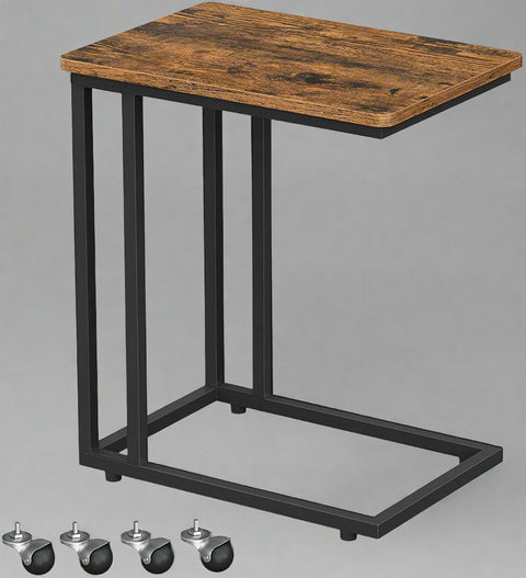 Rustic side table with laptop on top near sofa
Rolling wood TV tray with black metal legs
End table with wheels next to couch
Industrial-style side table for laptop and coffee