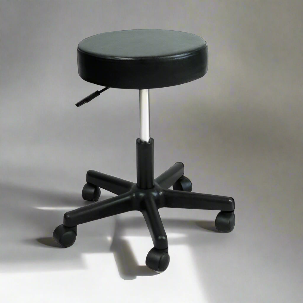 Adjustable black rolling stool with backless design for salon use

