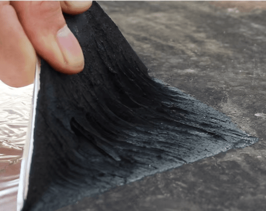 Self-adhesive asphalt patch tape unrolled for roof repair

Waterproof crack repair tape applied on concrete surface

Close-up of 2mm thick asphalt tape texture

DIY roof sealing with black asphalt repair tape

Roll of outdoor waterproof sealing tape on workbench
