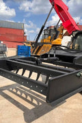 Skid Steer 72" Hydraulic Box Blade Leveler side view
Box grader with hydraulic rippers engaged
Attachment leveling gravel with skid steer
Close-up of pillow block bearings and rippers
Fully mounted box blade in action