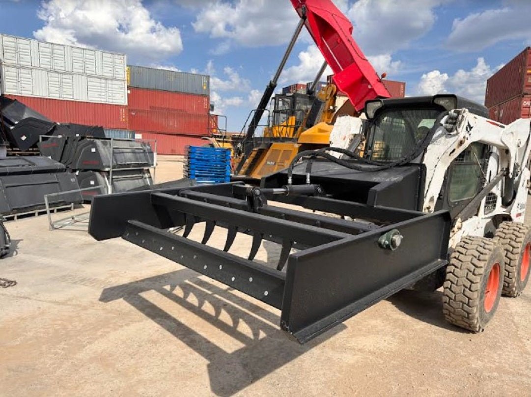 Skid Steer 72" Hydraulic Box Blade Leveler side view
Box grader with hydraulic rippers engaged
Attachment leveling gravel with skid steer
Close-up of pillow block bearings and rippers
Fully mounted box blade in action