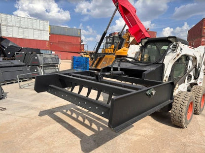 Skid Steer 72" Hydraulic Box Blade Leveler side view
Box grader with hydraulic rippers engaged
Attachment leveling gravel with skid steer
Close-up of pillow block bearings and rippers
Fully mounted box blade in action