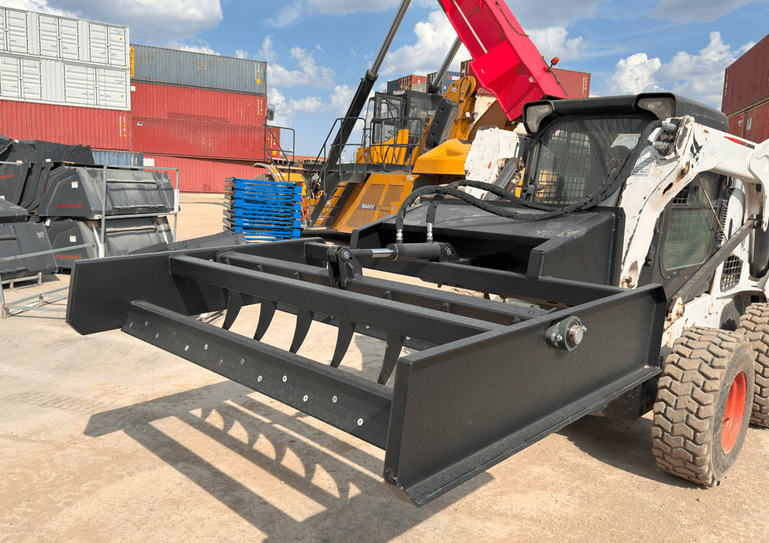 Skid Steer 72" Hydraulic Box Blade Leveler side view
Box grader with hydraulic rippers engaged
Attachment leveling gravel with skid steer
Close-up of pillow block bearings and rippers
Fully mounted box blade in action