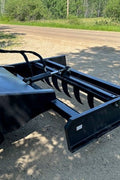 Skid Steer 72" Hydraulic Box Blade Leveler side view
Box grader with hydraulic rippers engaged
Attachment leveling gravel with skid steer
Close-up of pillow block bearings and rippers
Fully mounted box blade in action