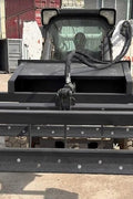 Skid Steer 72" Hydraulic Box Blade Leveler side view
Box grader with hydraulic rippers engaged
Attachment leveling gravel with skid steer
Close-up of pillow block bearings and rippers
Fully mounted box blade in action