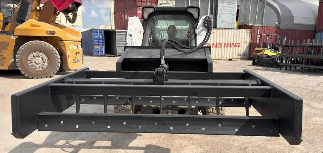 Skid Steer 72" Hydraulic Box Blade Leveler side view
Box grader with hydraulic rippers engaged
Attachment leveling gravel with skid steer
Close-up of pillow block bearings and rippers
Fully mounted box blade in action