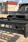 Skid Steer 72" Hydraulic Box Blade Leveler side view
Box grader with hydraulic rippers engaged
Attachment leveling gravel with skid steer
Close-up of pillow block bearings and rippers
Fully mounted box blade in action