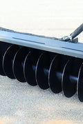 Trenching tool mounted on Bobcat-style skid steer