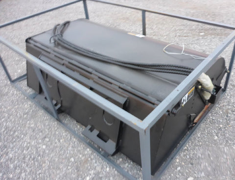 Skid steer bucket broom attachment with debris collected