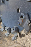 Hydraulic swing stump grinder attached to skid steer – front view
Side view of SG1308D stump grinder wheel and teeth
Close-up of carbide cutting wheel on stump grinder
