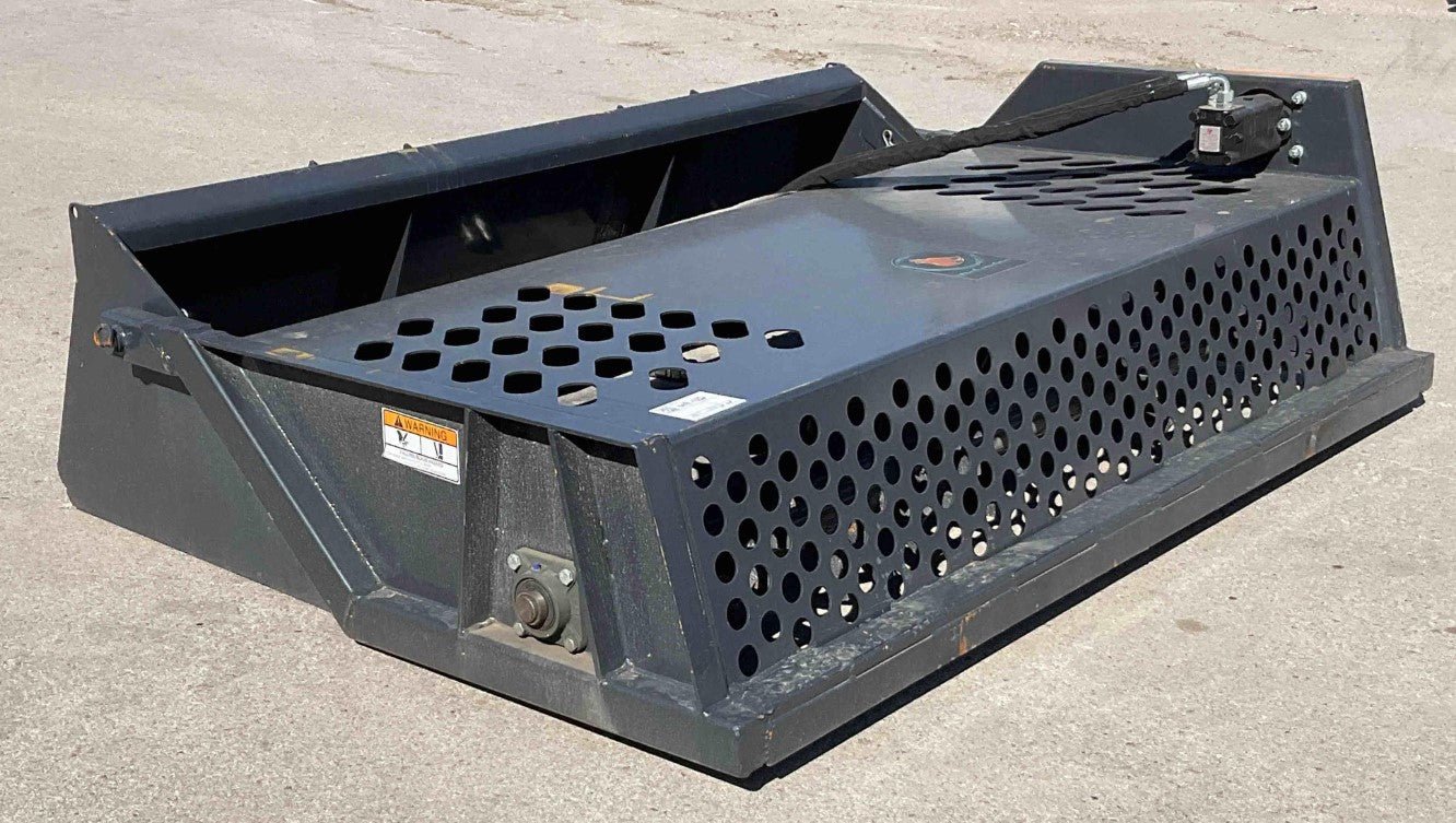 Front view of 84″ skid steer rock screener with hydraulic drum
Power root rake in action on construction site
Close-up of replaceable teeth on drum
Rear view showing universal skid steer mount
Heavy-duty rock rake screener with orange and black finish