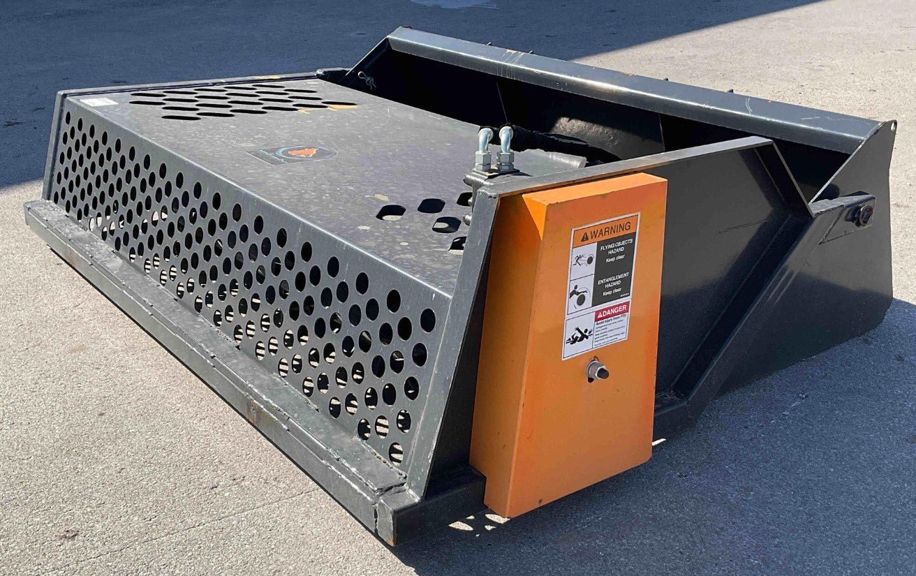 Front view of 84″ skid steer rock screener with hydraulic drum
Power root rake in action on construction site
Close-up of replaceable teeth on drum
Rear view showing universal skid steer mount
Heavy-duty rock rake screener with orange and black finish